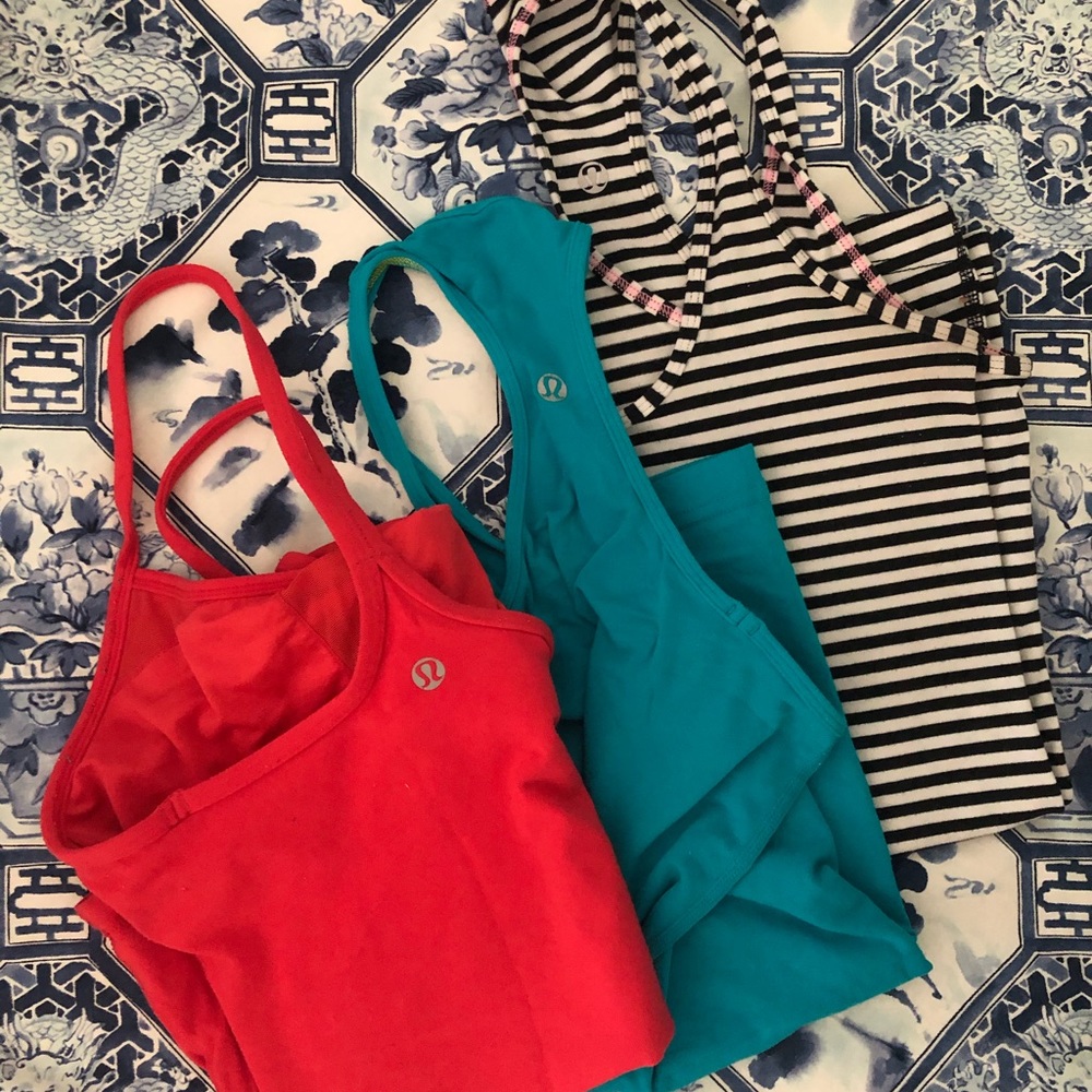 Trio of Lululemon work out tanks.